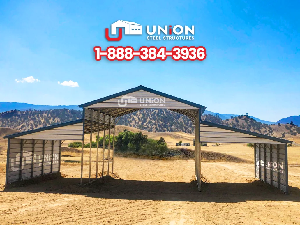 Open metal barn with a raised center roof and two side sections.